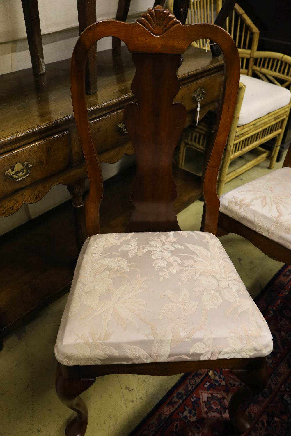 A reproduction mahogany twin pillar extending dining table and eight George I style chairs, 300cm extended (two spare leaves)
